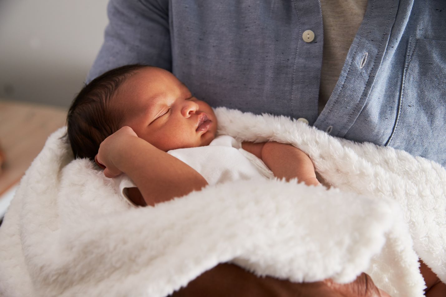 New mother holding newborn